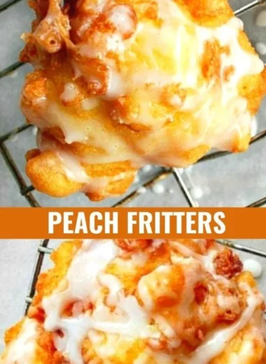 Freshly made peach fritters dusted with powdered sugar on a wooden table