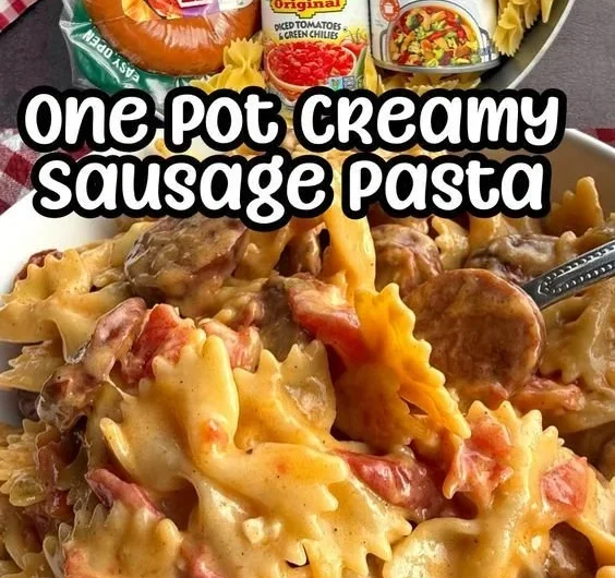 One Pot Creamy Cajun Sausage Pasta in a skillet garnished with parsley.