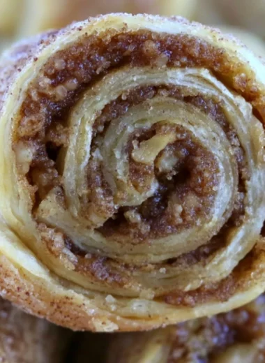 Brown Sugar and Walnut Rugelach pastry on a wooden table