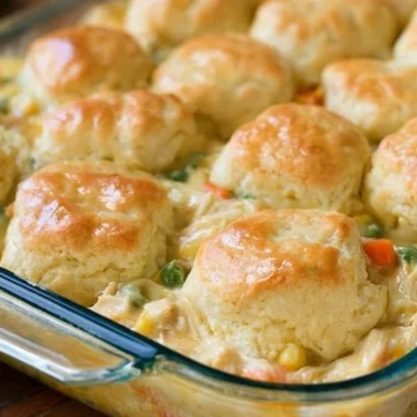 Delicious Chicken Pot Pie with Biscuits served hot in a rustic dish.