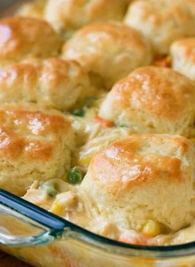 Delicious Chicken Pot Pie with Biscuits served hot in a rustic dish.