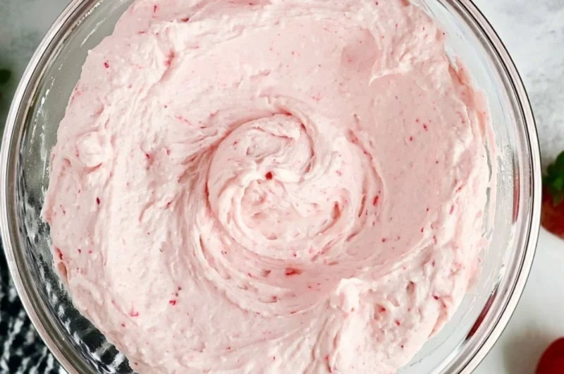 Delicious homemade fresh strawberry buttercream spread on a cupcake.