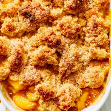 Delicious homemade peach cobbler dessert with sweet peaches and golden crust