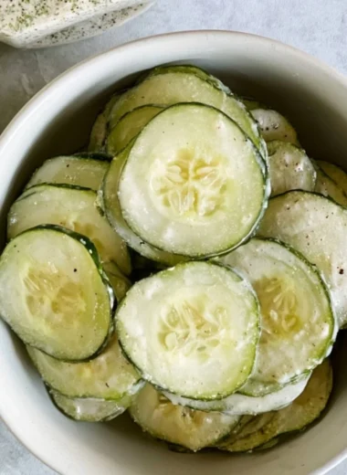 Fresh ranch cucumber chips served in a bowl, a healthy snack option.
