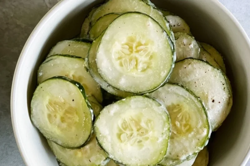 Fresh ranch cucumber chips served in a bowl, a healthy snack option.