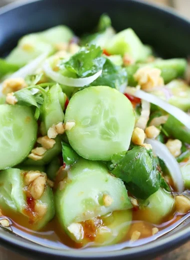 Delicious Thai cucumber salad garnished with fresh herbs and spices