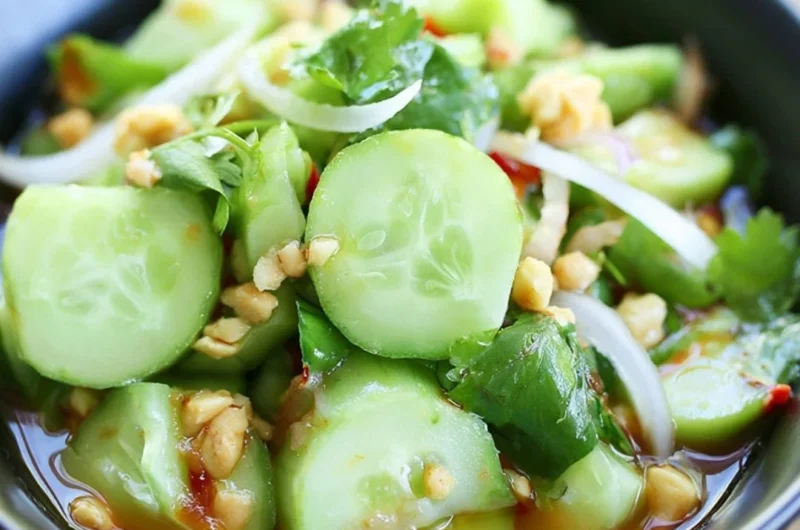 Delicious Thai cucumber salad garnished with fresh herbs and spices