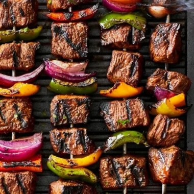 Deliciously grilled beef shish kabob with colorful vegetables on skewers.