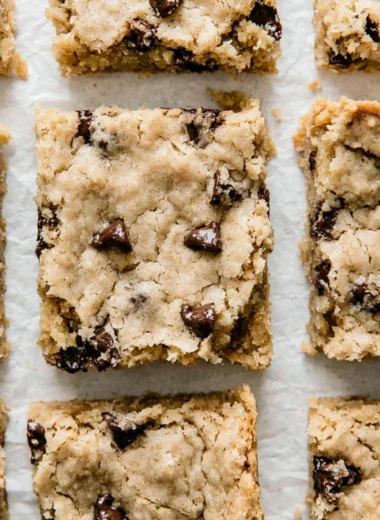 Cozy chocolate chip cookie bars baked to perfection with melted chocolate chips