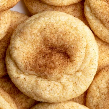 Cozy snickerdoodles fresh out of the oven, sprinkled with cinnamon sugar.