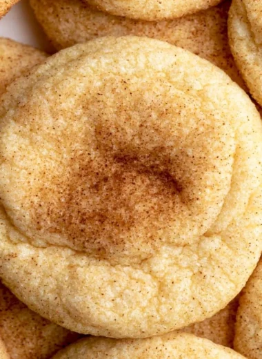 Cozy snickerdoodles fresh out of the oven, sprinkled with cinnamon sugar.