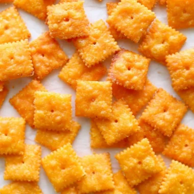 Delicious homemade cheese crackers on a rustic wooden table