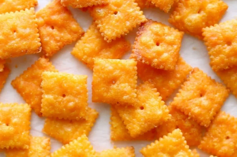 Delicious homemade cheese crackers on a rustic wooden table