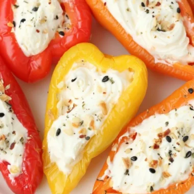 Everything bagel cream cheese stuffed peppers on a serving plate